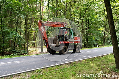 Heavy red digger or excavator Editorial Stock Photo