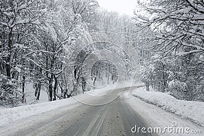 Heavy snow on a dirty slippery winter road Stock Photo