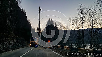 Heavy tonnage equipment that works to consolidate the road Stock Photo