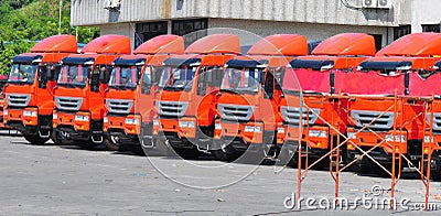 Heavy trucks in row Stock Photo