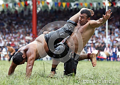 Heavy weight wrestlers compete at the Kirkpinar Turkish Oil Wrestling Festival, Turkey. Editorial Stock Photo