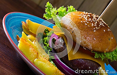 Heeseburger with beef cutlet, fresh vegetables and cheese with french fries Stock Photo