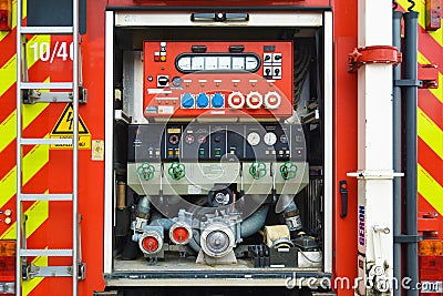 Open back side of red German fire truck with water supply connection Editorial Stock Photo