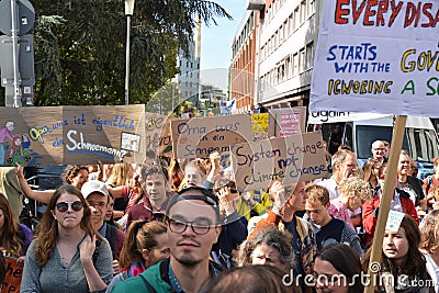 Demonstrants marching with protest signs held up during Global Climate Strike event Editorial Stock Photo