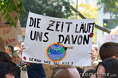 Demonstration during Global Climate Strike with banner held up saying `Time is running out` in German Editorial Stock Photo