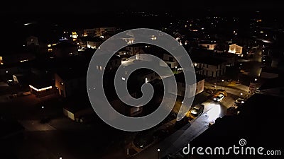 From the height of the quadcopter at night, the village below twinkles like a scattering of gemstones on a velvet cloth Stock Photo