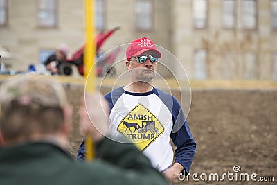Helena, Montana - April 19, 2020: Man wearing a red Keep America Great hat at a protest over the government shutdown due to the Editorial Stock Photo