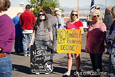 Helena, Montana / September 11, 2020: Protesters hold signs at mask protest, protesting mask mandate, women protest the governors Editorial Stock Photo