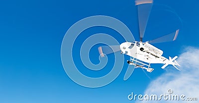 Heli Skiing Helicopter takes-off from a ski slope Stock Photo