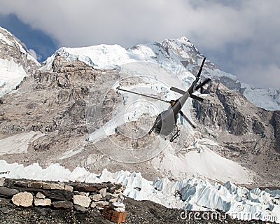 Helicopper in Mount Everest base camp and mount Nuptse Stock Photo