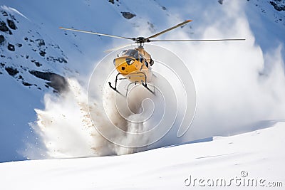helicopter dropping explosive charges for controlled avalanches Stock Photo