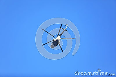 helicopter flies over forest Stock Photo