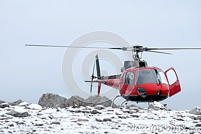 Helicopter landing on the mountain Stock Photo