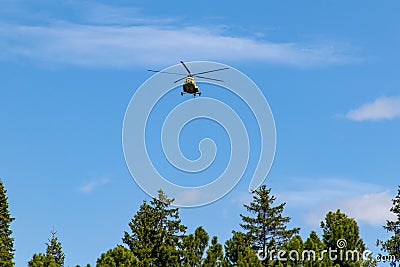 Helicopter over the taiga Stock Photo