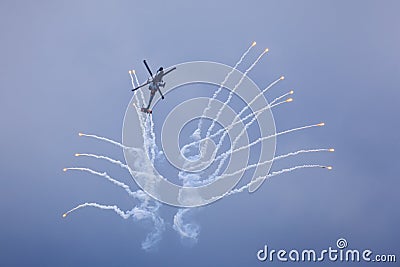 Helicopter releasing flares Stock Photo