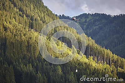 Helicopter rescue training simulation in a mountain range wood. Accident Stock Photo