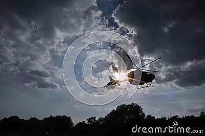 Helicopter in sun`s rays Stock Photo