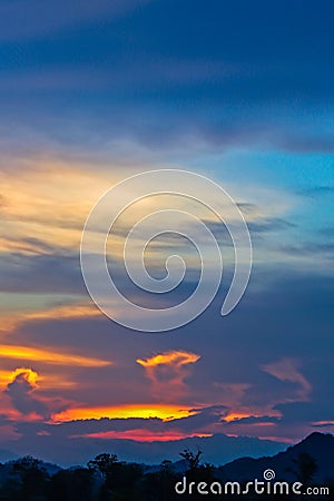 Hell in Heaven colorful Clouds Silhouette blue Sky Background Evening golden sunset Stock Photo