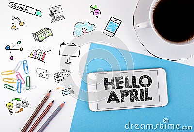 Hello april, business Concept. Mobile phone and coffee cup on a white office desk Stock Photo