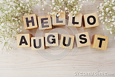 Hello august alphabet letters on wooden background Stock Photo