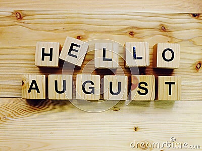 Hello august wooden block alphabet letters on wooden background Stock Photo