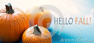 Hello autumn banner; thanksgiving holiday party background with autumn pumpkin on blue background Stock Photo