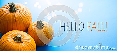 Hello autumn banner; thanksgiving holiday party background with autumn pumpkin on blue background Stock Photo