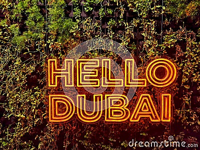 HELLO DUBAI Neon cool text welcoming people to Dubai city Stock Photo