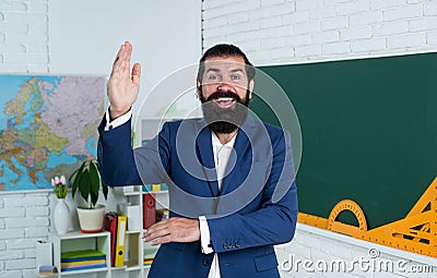 hello. happy man with beard wearing formal suit. process of studying. informal education. male student in school Stock Photo