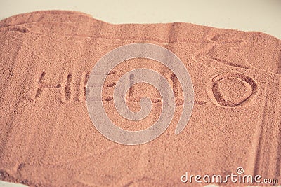 `Hello` inscription on the sand Stock Photo