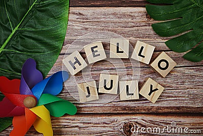 Hello July message alphabet letter on wooden background Stock Photo