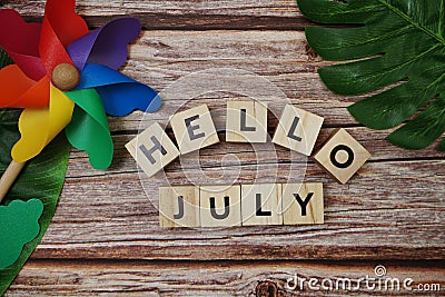 Hello July message alphabet letter on wooden background Stock Photo