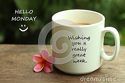 Hello Monday greetings with a smile face emoticon - Wishing you a really great week. With white mug of coffee and notes on it. Stock Photo