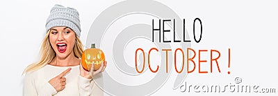 Hello October with woman holding a pumpkin Stock Photo