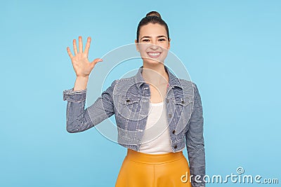 Hello! Portrait of friendly sociable woman in stylish casual clothes gesturing hi, welcoming with raised hand Stock Photo