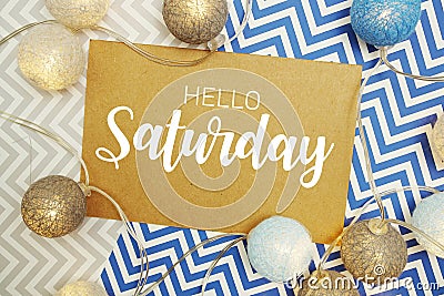 Hello Saturday typography text on paper card with LED cotton balls decoration Stock Photo