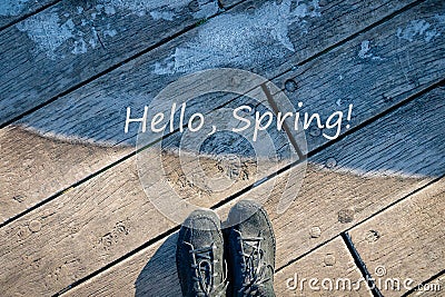 Hello Spring words. Concept of transition from winter to spring. Spring is coming. Warm and cold, frost and sun Stock Photo