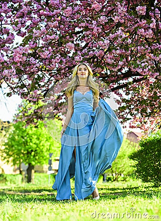 Hello summer. sexy lady in park. Spring woman in cherry flower bloom. girl pink blossom. fashion model in japanese Stock Photo