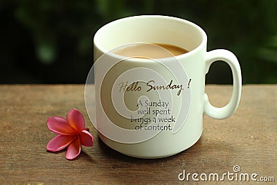 Hello Sunday greetings and quote on white mug of coffee - A Sunday well spent brings a week of content. Morning coffee. Sunday Stock Photo