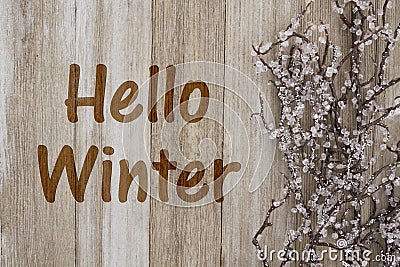 Hello Winter message on weathered wood Stock Photo