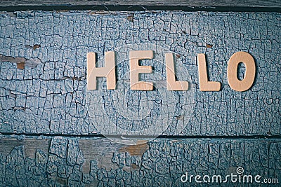 Hello wooden word written with wood letters on a wooden blue textured surface Stock Photo