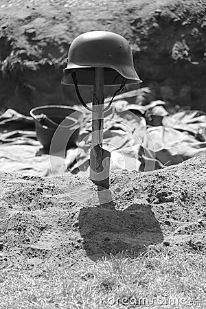 German second world war II helmet on a shovel