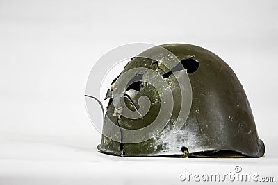 Helmet of a soldier of the red army of the USSR during the great Patriotic War with the consequences of shrapnel and bullets Stock Photo