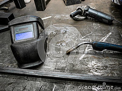 Helmet for welding on a locksmiths table Stock Photo