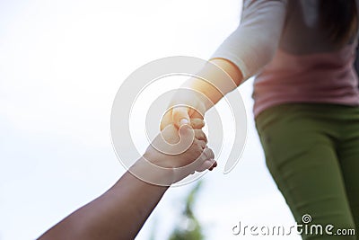 Help Concept Young girl Hands reaching out to help old Stock Photo
