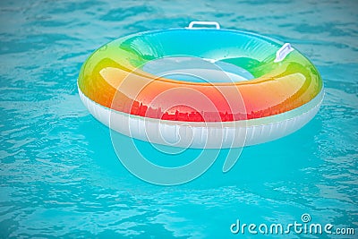 Help for drowning person. Rubber circle, swimming pool. Summertime. Stock Photo