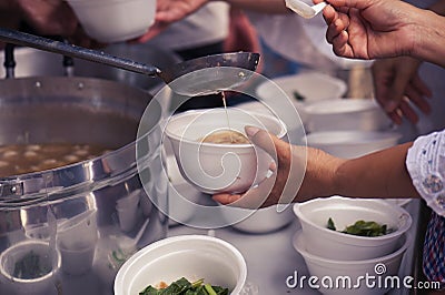 Help with feeding homeless people to alleviate hunger. poverty concept Stock Photo