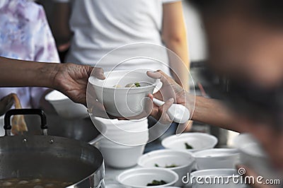 Help with feeding homeless people to alleviate hunger. poverty concept Stock Photo