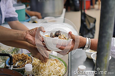 Help serving free food to the poor Needy : concept Sharing Food With Homeless Stock Photo