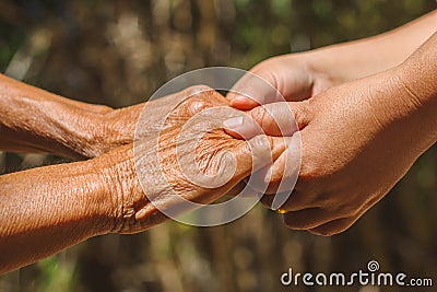 Helping hands, care for the elderly concept Stock Photo